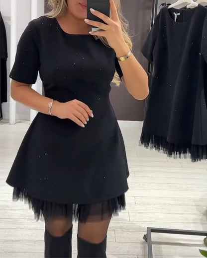 Martina | Vestido Negro Acampanado con Detalles Luminosos y Dobladillo de Tul