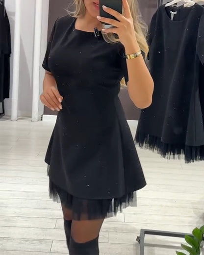 Martina | Vestido Negro Acampanado con Detalles Luminosos y Dobladillo de Tul